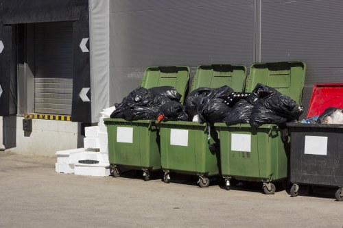 Recyclable materials being sorted for builders waste in Golders Green